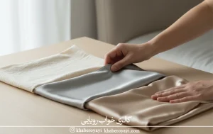 «کاربر در حال لمس پارچه برای بررسی نرمی و انتخاب بهترین جنس روبالشتی مناسب پوست‌های حساس»

