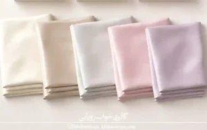 چند روبالشتی کتان ساتن با رنگ‌بندی مختلف کنار هم
